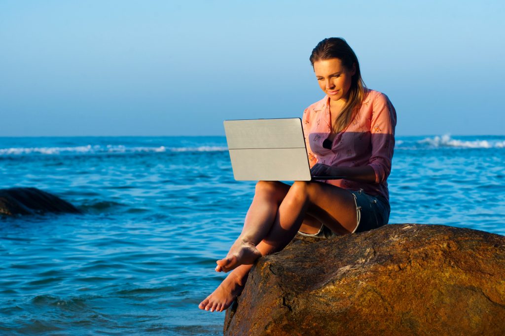 How Gen Alpha Is Funding Luxury Travel in 2026 — The Smart Money Moves Nobody Talks About laptop beach