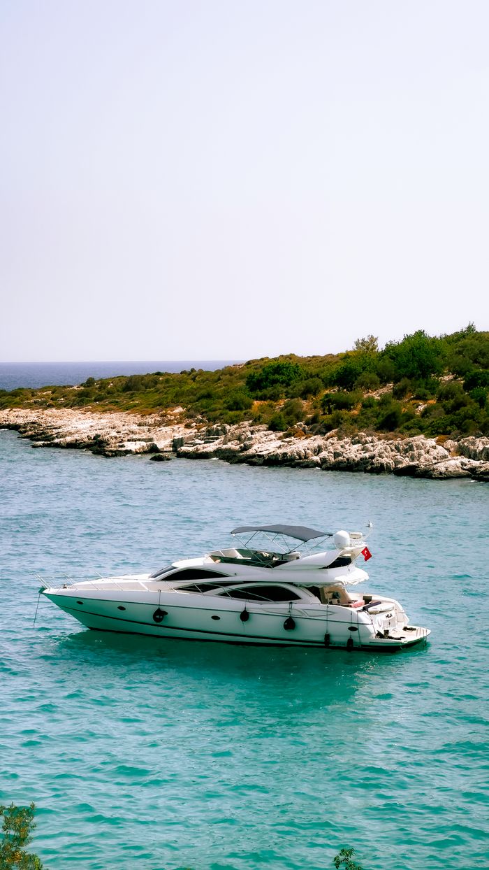 gallery-6 A luxury yacht anchored in the turquoise waters off the coast of Silifke, Mersin, Türkiye, showcasing a serene oceanic view.